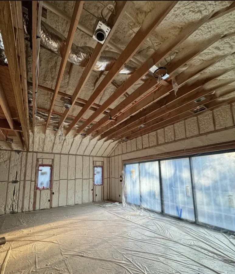 Interior walls and ceiling insulated with spray foam during new construction in Triangle